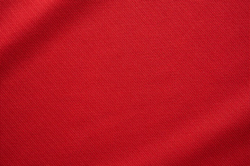 Red sports clothing fabric football jersey texture close up