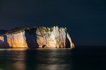 Etretat, Normandy, France - The cliffs at the south ('Aval' cliff) with its natural arch, by night