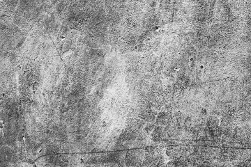 Texture of a concrete wall with cracks and scratches which can be used as a background