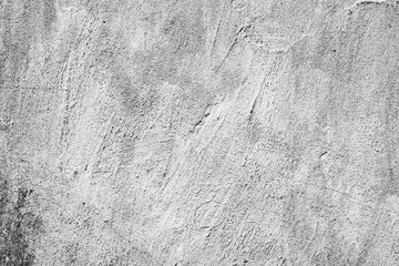 Naklejka premium Texture of a concrete wall with cracks and scratches which can be used as a background
