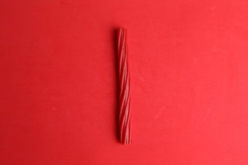 sweet red gummy licorice in color background