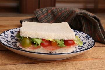 Spanish serrano ham sandwich with tomato and lettuce