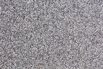 Close up of a natural stone carpet. Decorative stone coating. Slip resistant floor finish containing natural stone particles