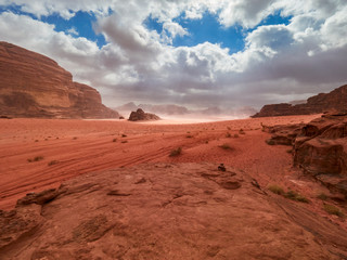 Fototapeta na wymiar Beautiful Scenery Scenic Panoramic View Red Sand Desert and Ancient Sandstone Mountains Landscape in Wadi Rum, Jordan