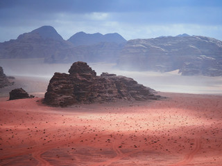 Beautiful Scenery Scenic Panoramic View Red Sand Desert and Ancient Sandstone Mountains Landscape in Wadi Rum, Jordan during a Sandstorm