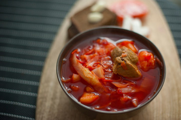 borsch with meat in a plate rye bread lard garlic