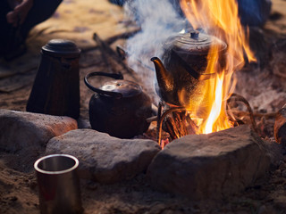 Traditional bedouin tea on fire in the Wadi Rum desert, Jordan - obrazy, fototapety, plakaty