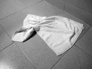 used towel lying on floor