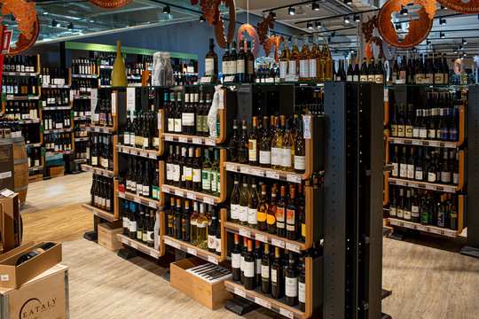 ROME, ITALY - FEBRUARY 17, 2019: Large Italian wines selection on the shelves of Eataly, one of the most famous Italian food halls.