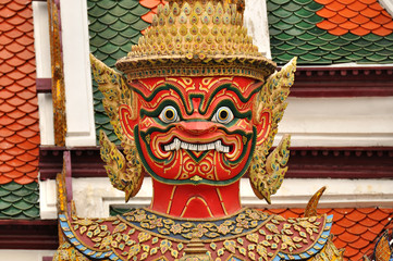 Closeup face of giant or Yaks-ha at Wat Ph-ra Kaew in Bangkok, Thailand. Wat Phra Kaew or The...