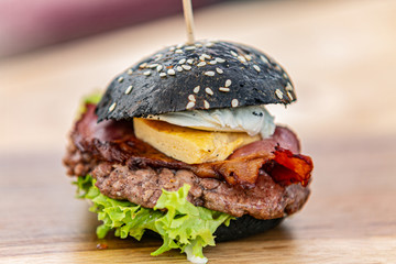 Sandwich hamburger with and mix of vegetables. Fast food. Delicious hamburger