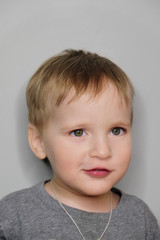 Studio portrait of happy smiling baby boy; studio shot