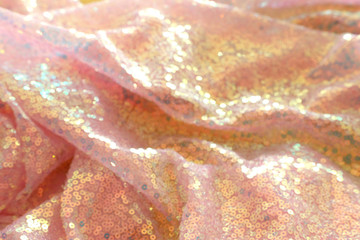 Bokeh and abstract background of beautiful golden sequins fabric