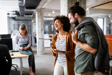 Business people having fun and chatting at workplace office