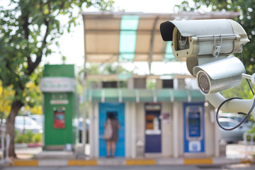 Closeup of traffic security camera surveillance (CCTV) on the road in the big city.
