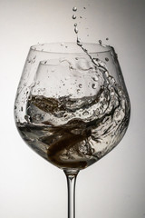 A glass of water close-up. Freezing, drops of water, advertising, pour