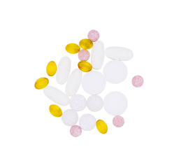 Different vitamins, pills and capsules isolated against a white background.