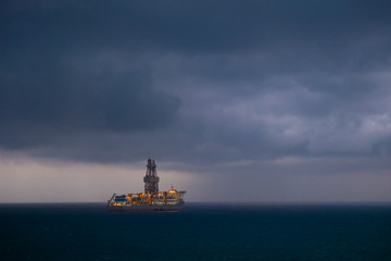 offshore oil drilling ship before the storm in the sea 