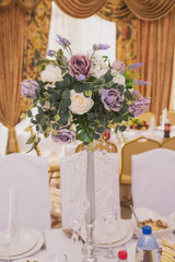 Decoration of the Banquet with vases of flowers and flower arrangements