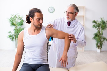 Young male patient visiting experienced doctor