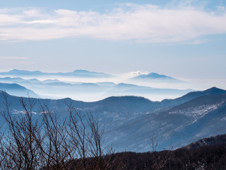 mountain range of the Campania Apennines with snow and mist. the Vesuvius volcano on the right and the Lattari mountains on the left