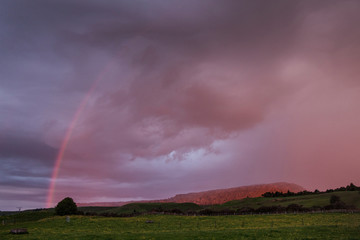 Naklejka na ściany i meble Tongariro National Park New Zealand. Rainbow. Sunset sky