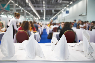 Table setting Selected focus People eat in a cafe. Blurred background..