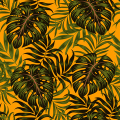 Stylish tropical seamless pattern with leaves and plants on a yellow background. Summer background with exotic leaves. Trendy summer Hawaii print.  Floral pattern. Creative abstract background. 