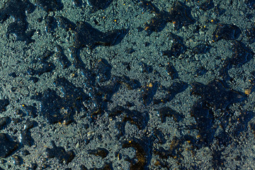 Water drops on asphalt textured abstract background