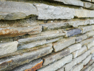 Simple stone wall texture. Graphic design background. Selective focus.