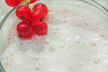 Milkshake and red currant berries