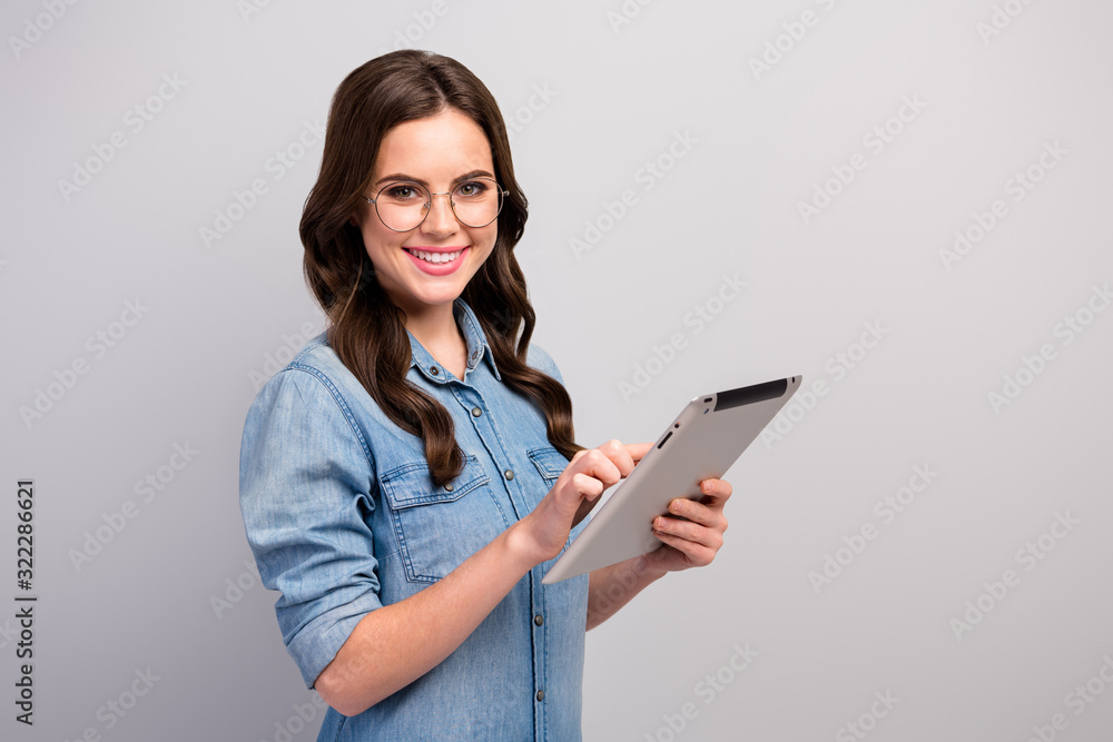 Wall mural profile photo of pretty freelancer lady hold e-reader tablet searching information reading report pr