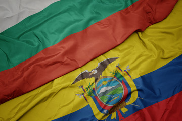 waving colorful flag of ecuador and national flag of bulgaria.