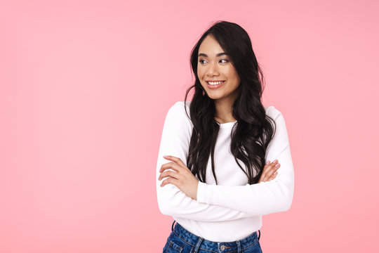 Image Of Young Brunette Asian Woman Standing With Arms Crossed