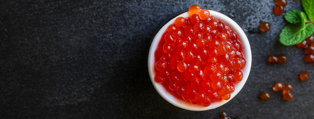 red caviar (seafood, salmon caviar) menu concept. food background. top view. copy space