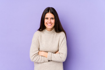 Obraz premium Young caucasian woman isolated on purple background laughing and having fun.