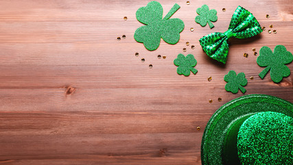 Happy Saint Patrick's Day greeting card with traditional symbols, shamrock, green attire. Green...