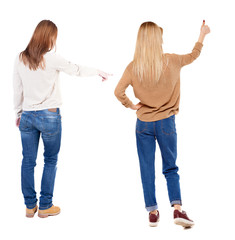 Back view of two pointing young girl in sweater.