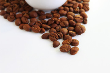 Roasted coffee beans pile isolated on white background. From top view