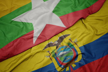 waving colorful flag of ecuador and national flag of myanmar.