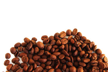 Roasted coffee beans pile isolated on white background. From top view