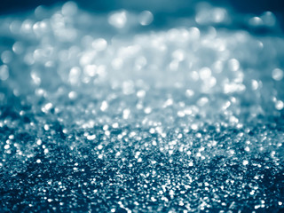 blue glitter christmas abstract background.Blurred bright light.
