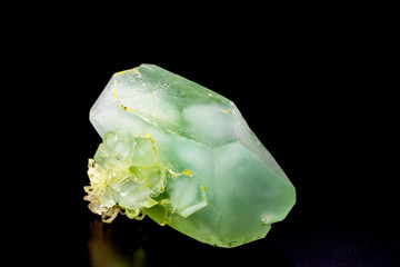 Green crystalline minerals on a black background