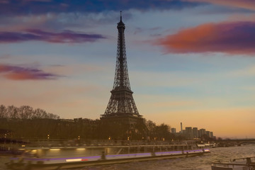 Motion blur of boat in the seine river with Eiffel tower, Paris. France ,sunset sky scene