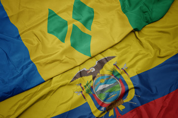 waving colorful flag of ecuador and national flag of saint vincent and the grenadines.