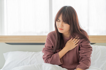 Asian women Heart disease on bed