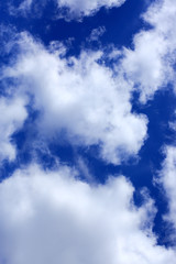 Blue summer sky background with white clouds. Nature background.