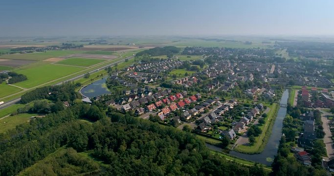 Dutch City Franeker, Houses in a Neighbourhood next to the A31 Highway, Shot Moving Forward Left, Friesland, Netherlands / Holland &ndash; 4K Drone Footage
