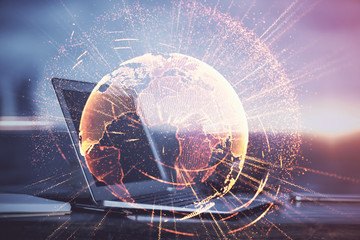 Obraz premium Computer on desktop with social network hologram. Multi exposure. Concept of international people connections.