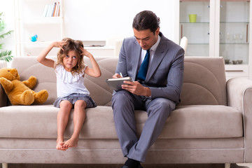 Child psychologist attending small girl